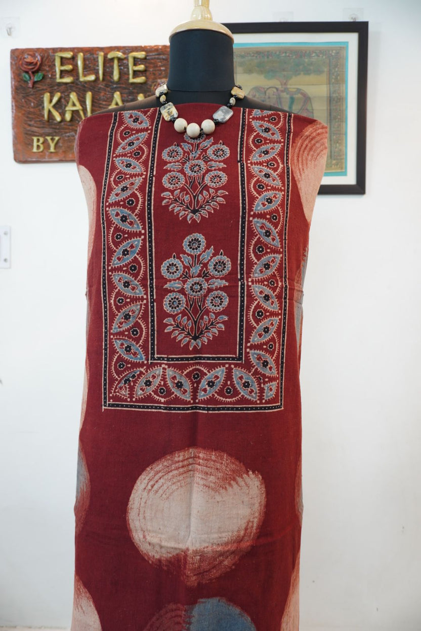 Red rust kurti fabric with multicolor block print pattern and visible border