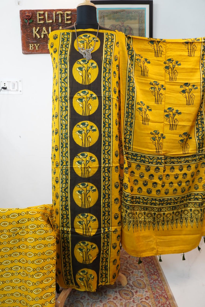 Yellow Ajrakh handblock floral 3 piece suit with black, green and blue accents, border and tassels