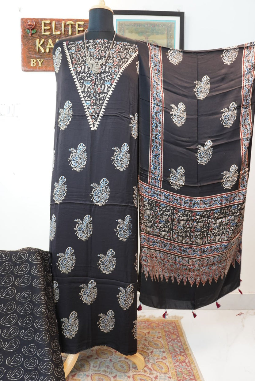 Black Ajrakh handblock style 3 piece suit with stole, multicolor placement pattern, warli neck design, border and tassels