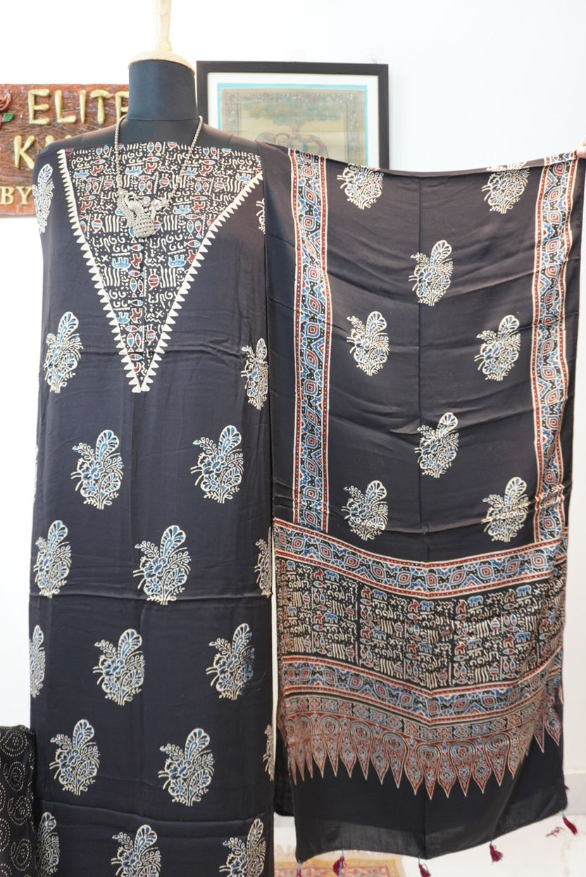 Black Ajrakh handblock style 3 piece suit with stole, multicolor placement pattern, warli neck design, border and tassels