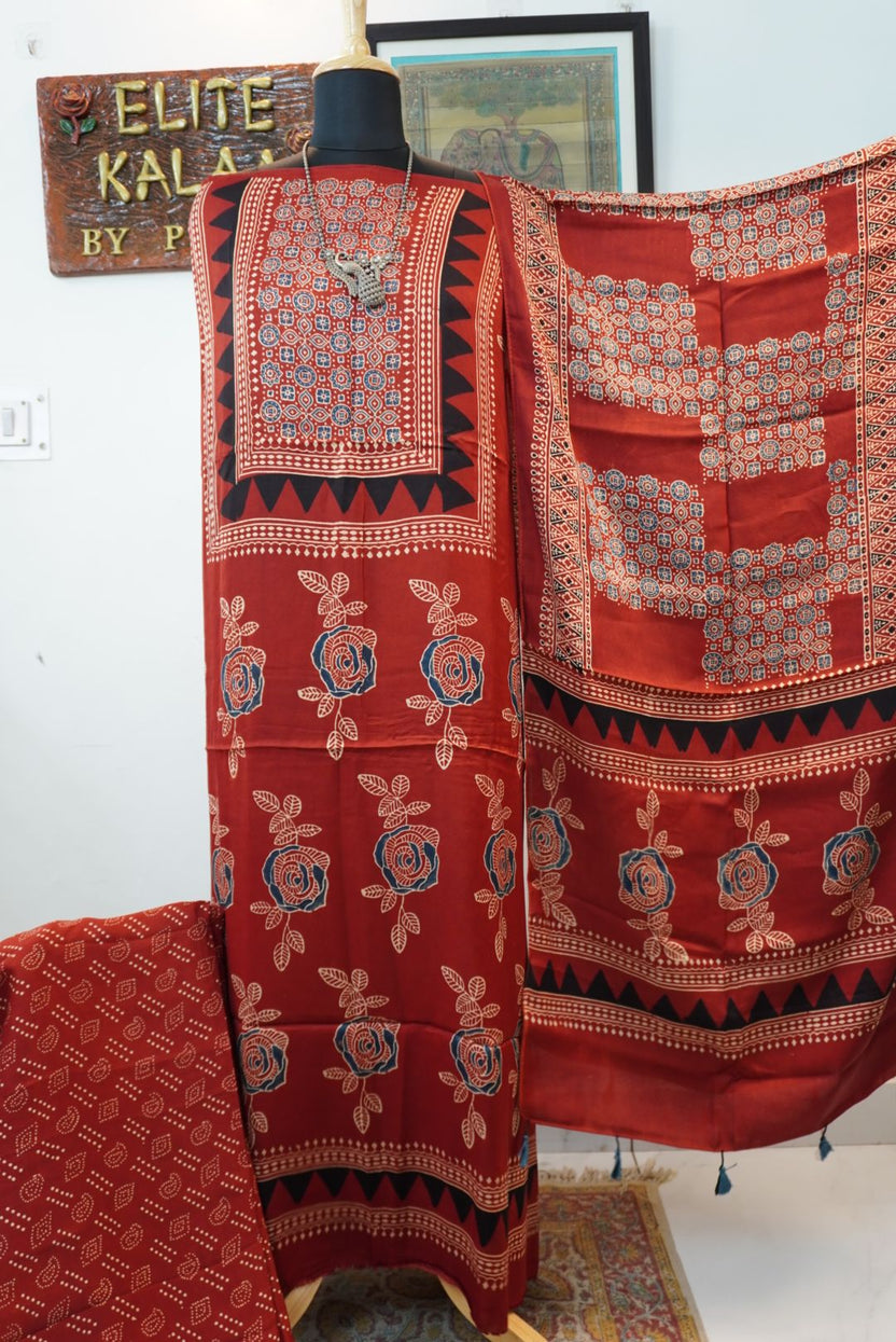 Red Ajrakh-style block print 3 piece suit with stole, rose boota pattern, blue, cream and black accents