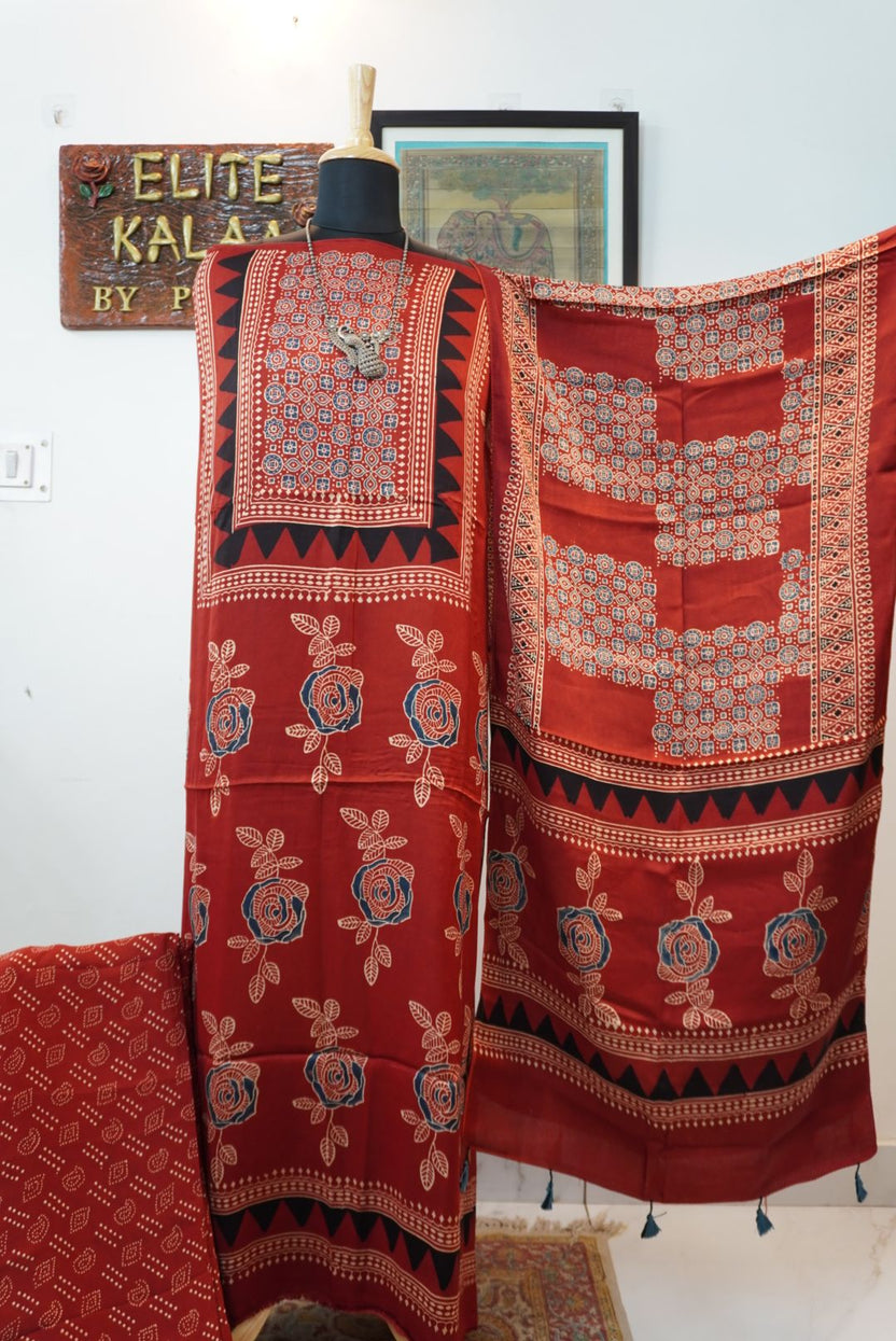 Red Ajrakh-style block print 3 piece suit with stole, rose boota pattern, blue, cream and black accents