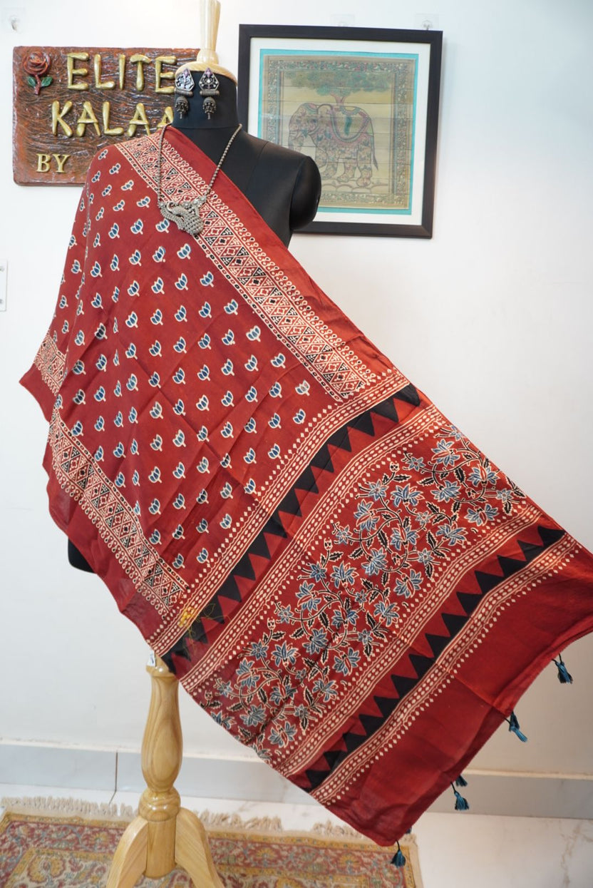 Red Ajrakh modal stole with small lotus all-over design, blue black and white accents, border and tassels