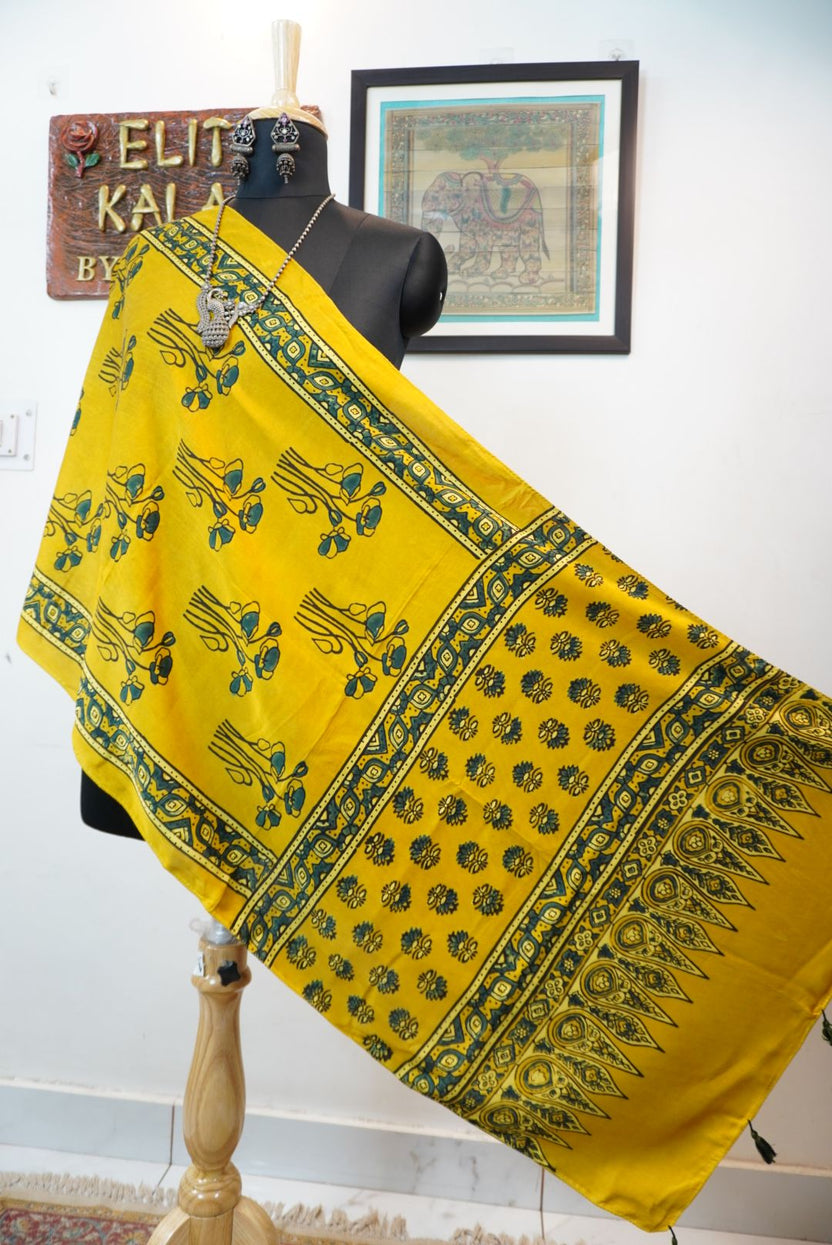 Yellow Ajrakh modal stole with floral design, blue green and black detailing, and border