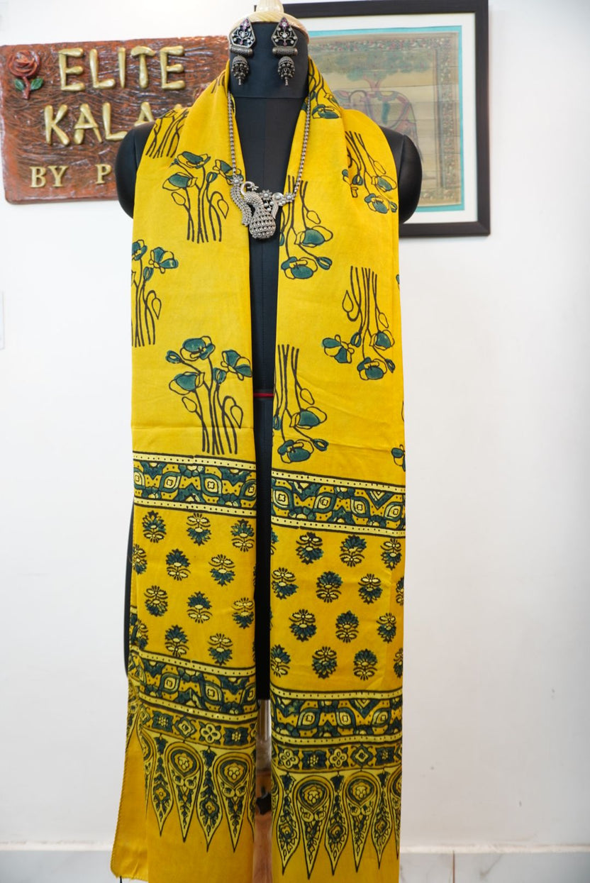 Yellow Ajrakh modal stole with floral design, blue green and black detailing, and border