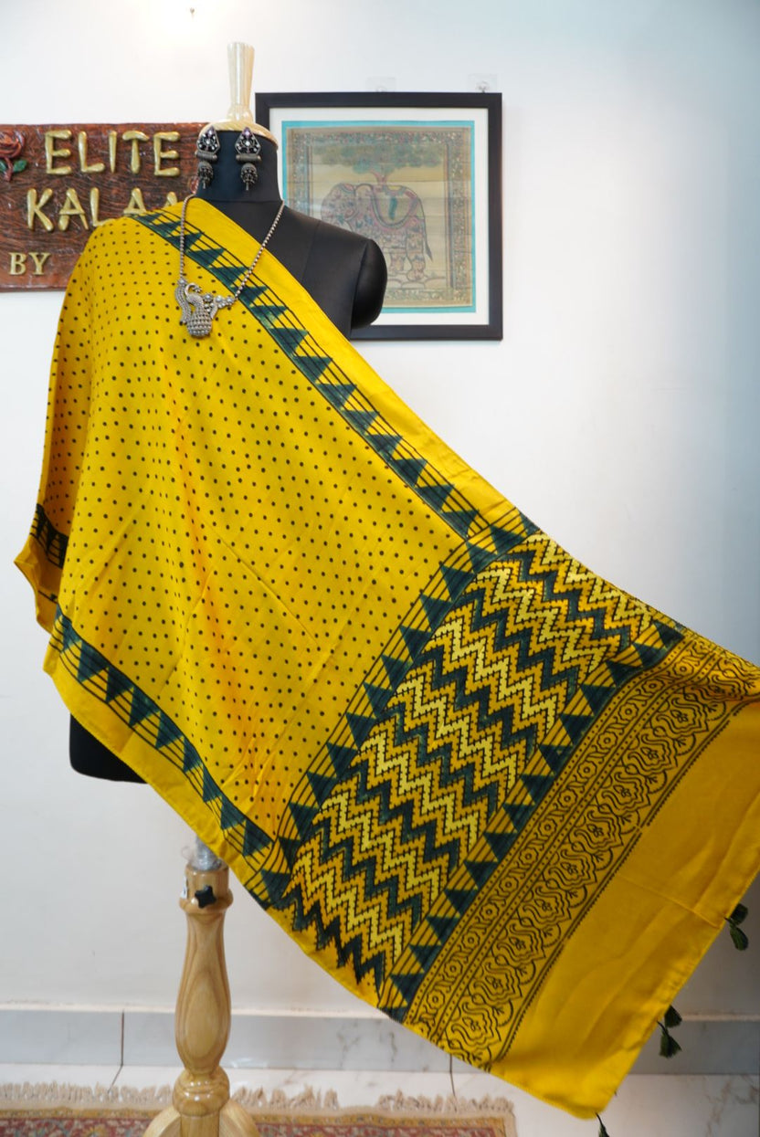 Yellow Ajrakh modal stole with green and black all-over polka dot pattern, border and tassels