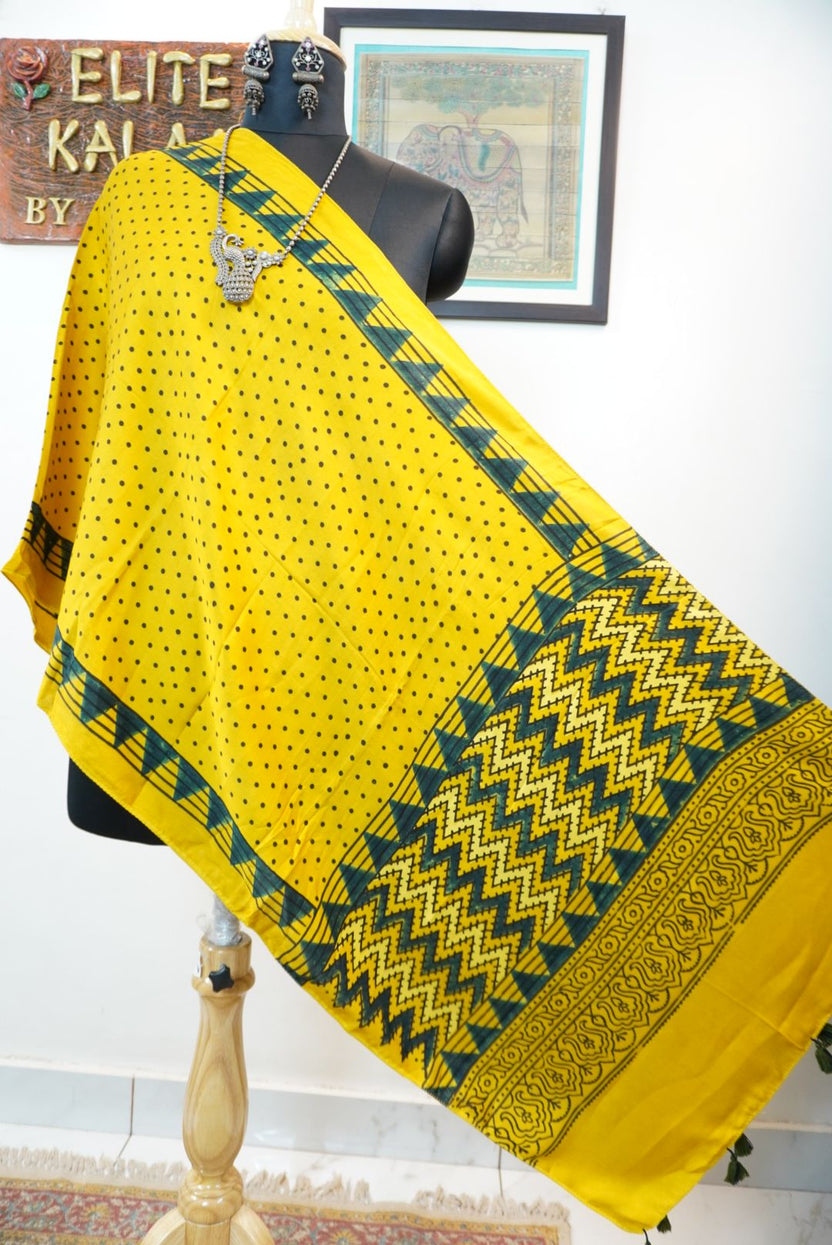 Yellow Ajrakh modal stole with green and black all-over polka dot pattern, border and tassels