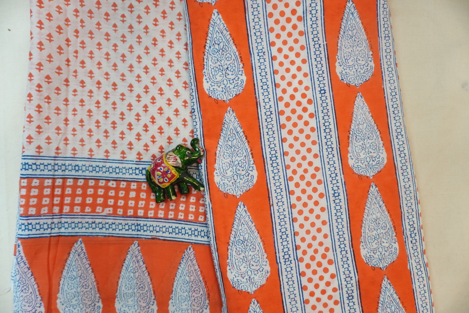 Orange cotton Bagh printed 3 piece suit set with white and blue placement pattern and border detail