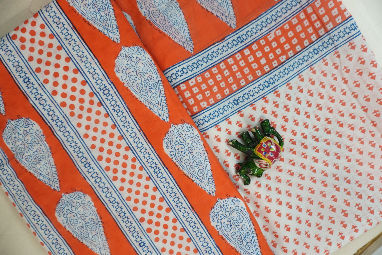 Orange cotton Bagh printed 3 piece suit set with white and blue placement pattern and border detail