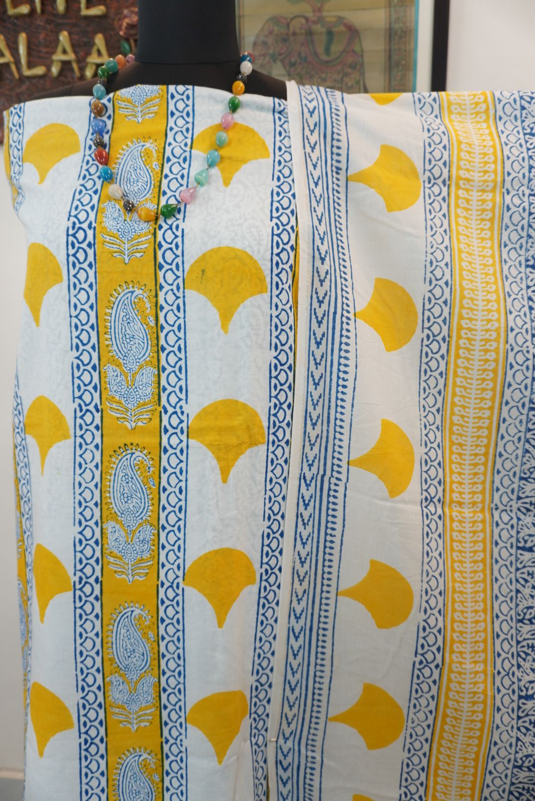 Yellow cotton Bagh handblock 3 piece unstitched suit set with blue and white accents and border