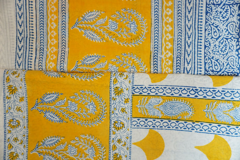Yellow cotton Bagh handblock 3 piece unstitched suit set with blue and white accents and border