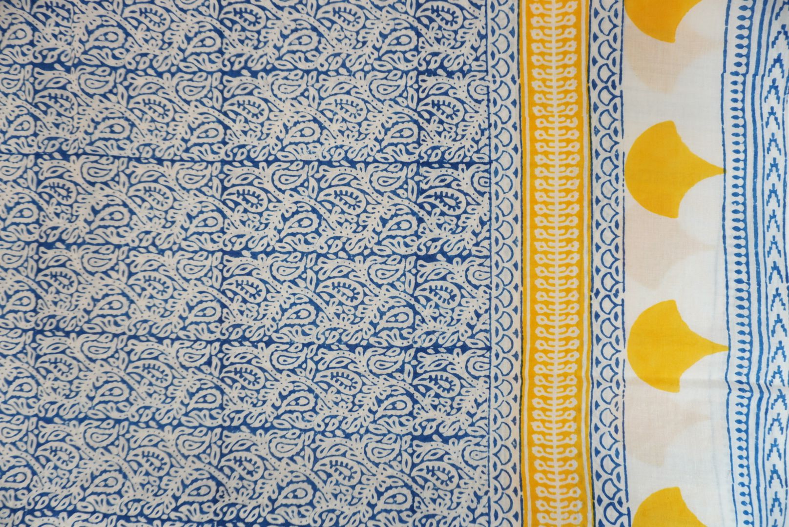 Yellow cotton Bagh handblock 3 piece unstitched suit set with blue and white accents and border
