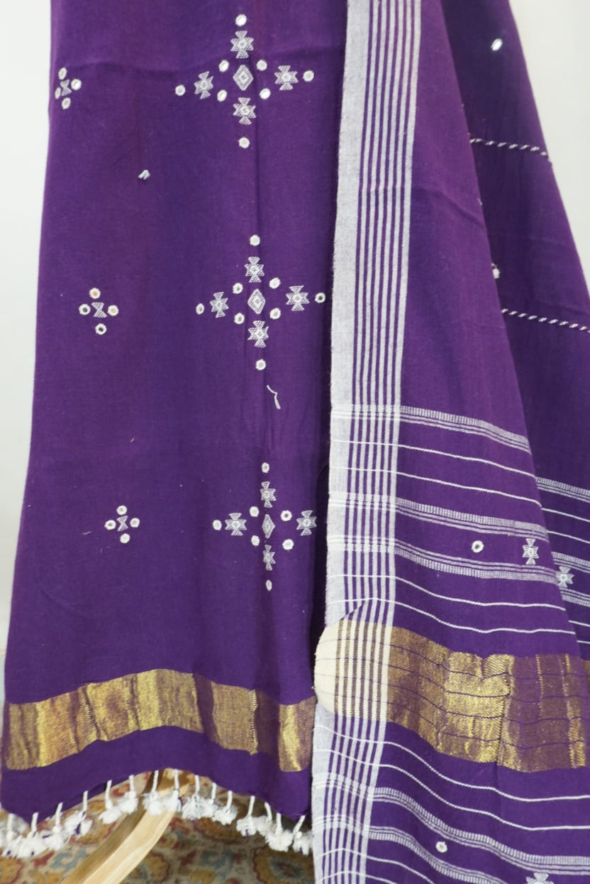 Purple dress material with border, tassels and fringe detail