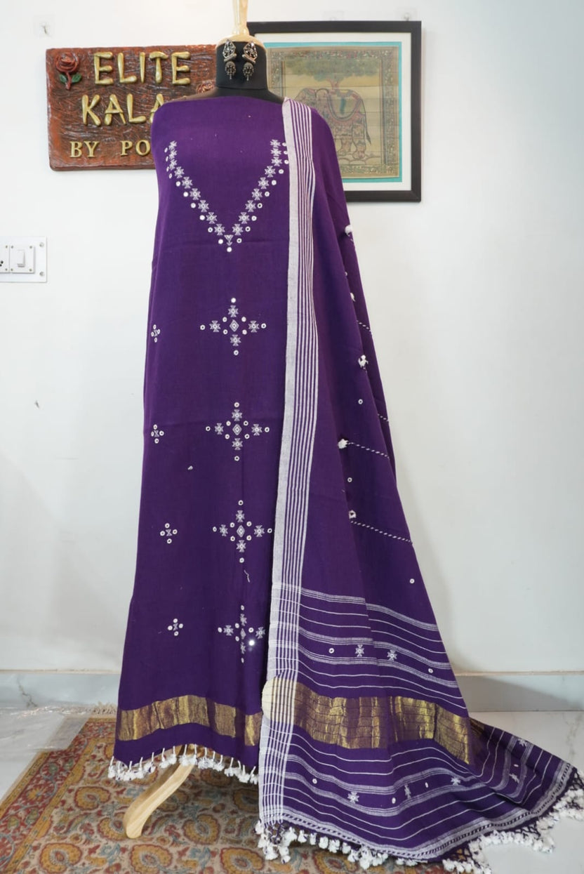 Purple dress material with border, tassels and fringe detail