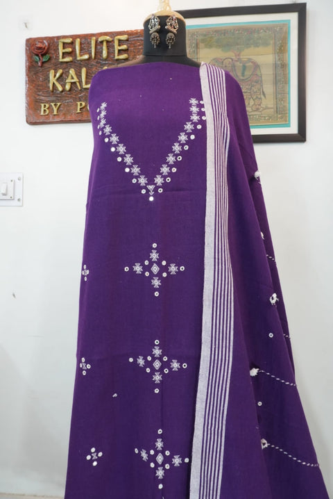 Purple dress material with border, tassels and fringe detail