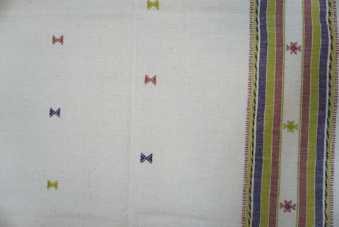 Off white Bhujodi Kala cotton kurti with multicolor placement pattern, neck chomuk and daaman work, and border