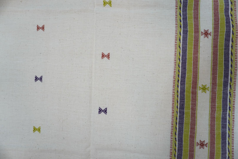 Off white Bhujodi Kala cotton kurti with multicolor placement pattern, neck chomuk and daaman work, and border