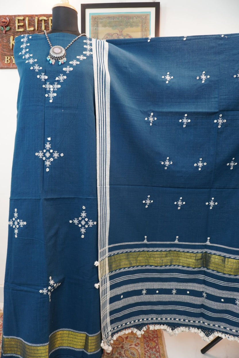Teal blue 3 pc dress material with white and green geometric design, border, tassels and fringe