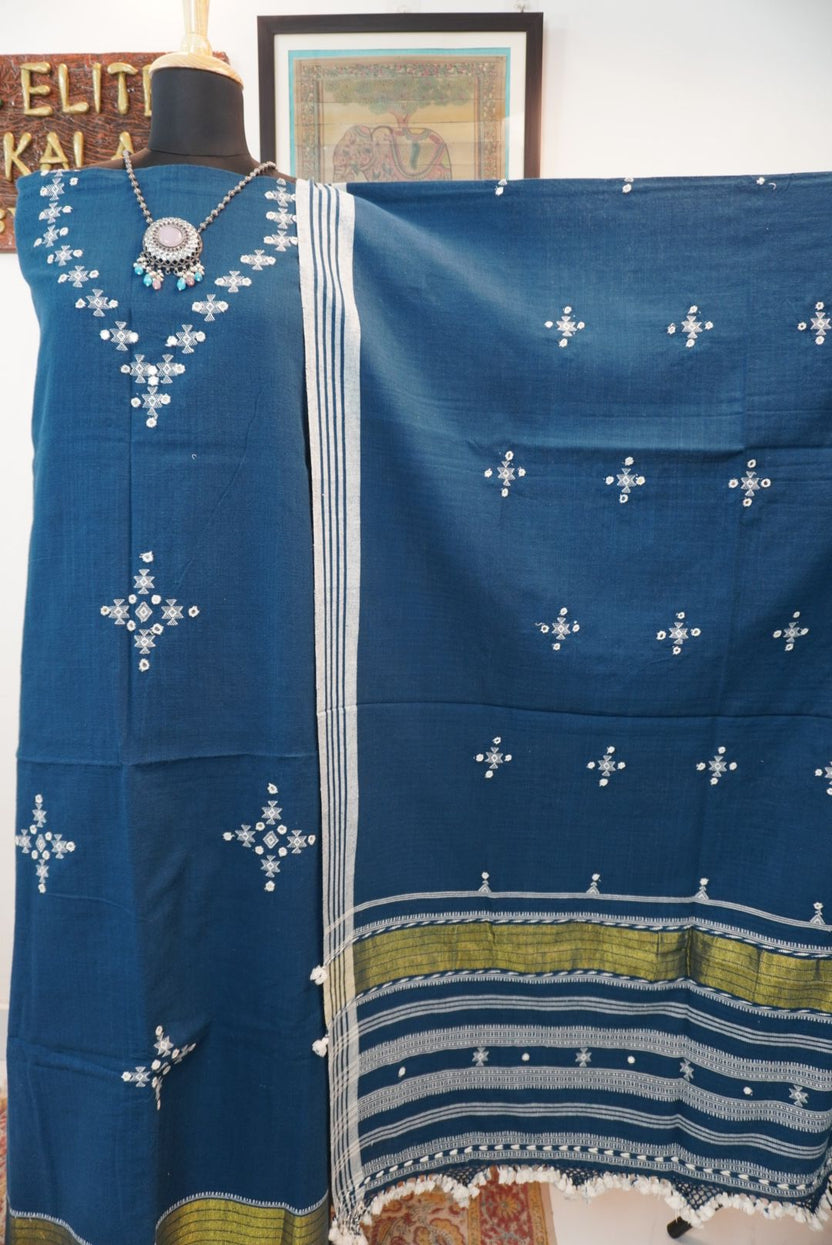 Teal blue 3 pc dress material with white and green geometric design, border, tassels and fringe