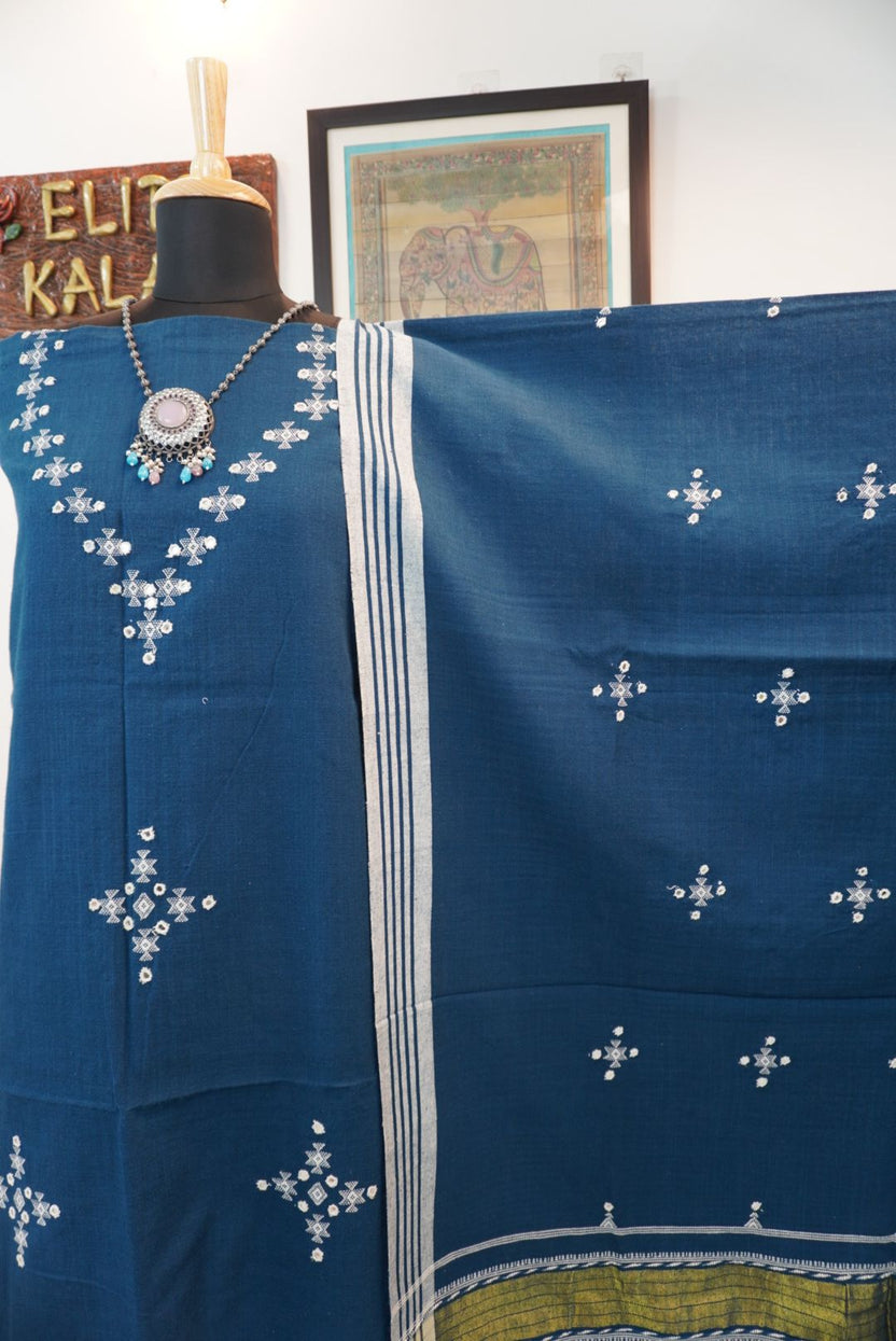 Teal blue 3 pc dress material with white and green geometric design, border, tassels and fringe