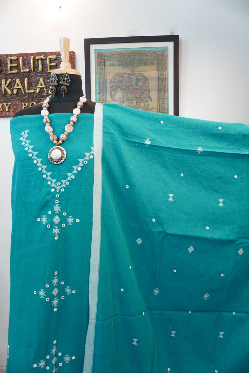 Green 3 piece dress material with placement pattern, border detail and tassels
