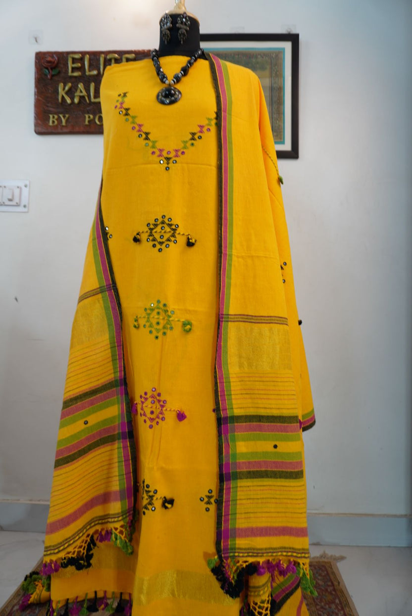 Yellow Bhujodi kala cotton suit fabric with multicolour placement pattern, border, tassels and fringe