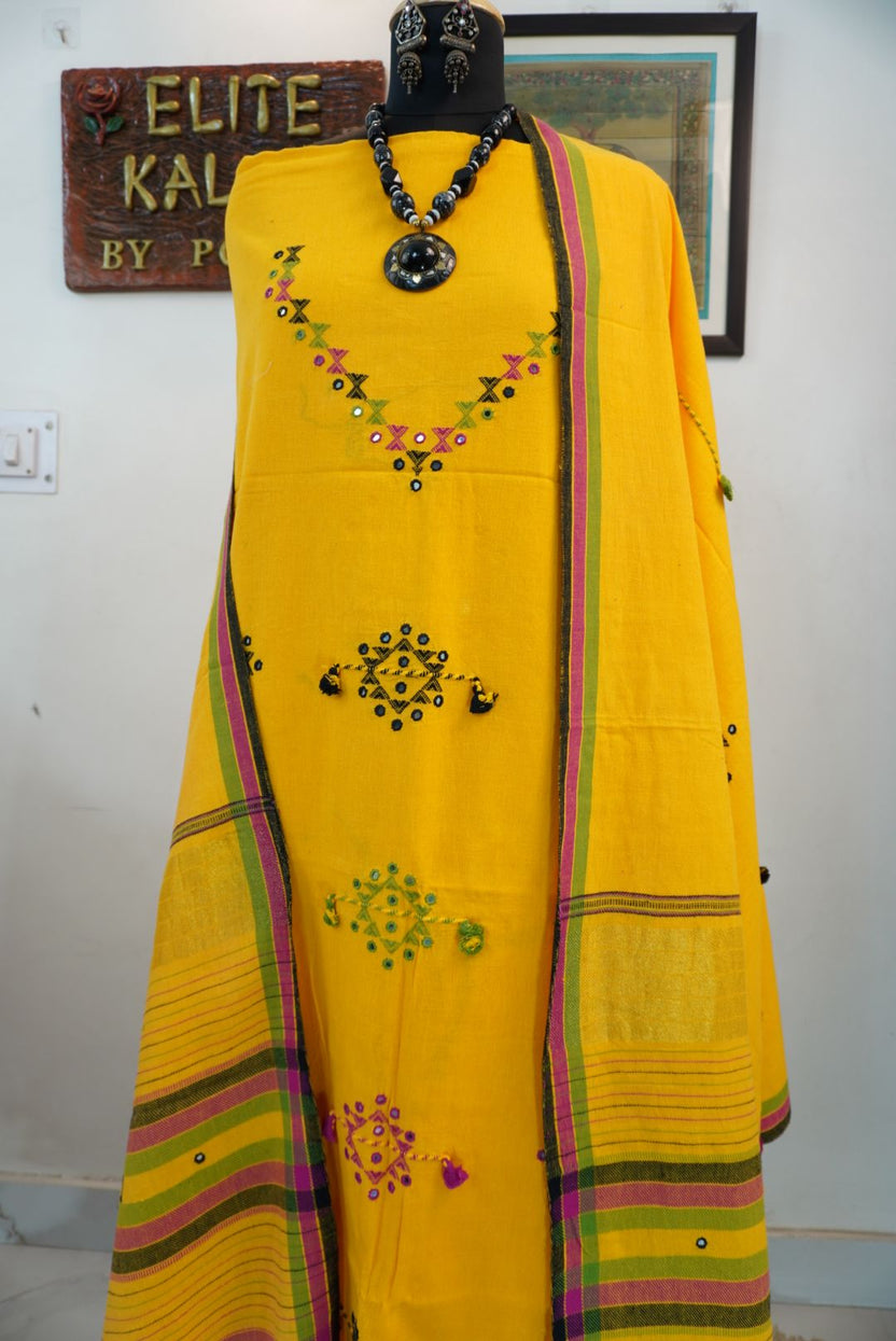 Yellow Bhujodi kala cotton suit fabric with multicolour placement pattern, border, tassels and fringe
