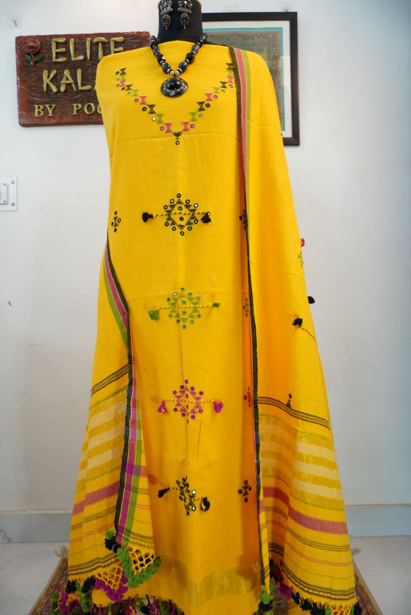 Yellow Bhujodi kala cotton suit fabric with multicolour placement pattern, border, tassels and fringe