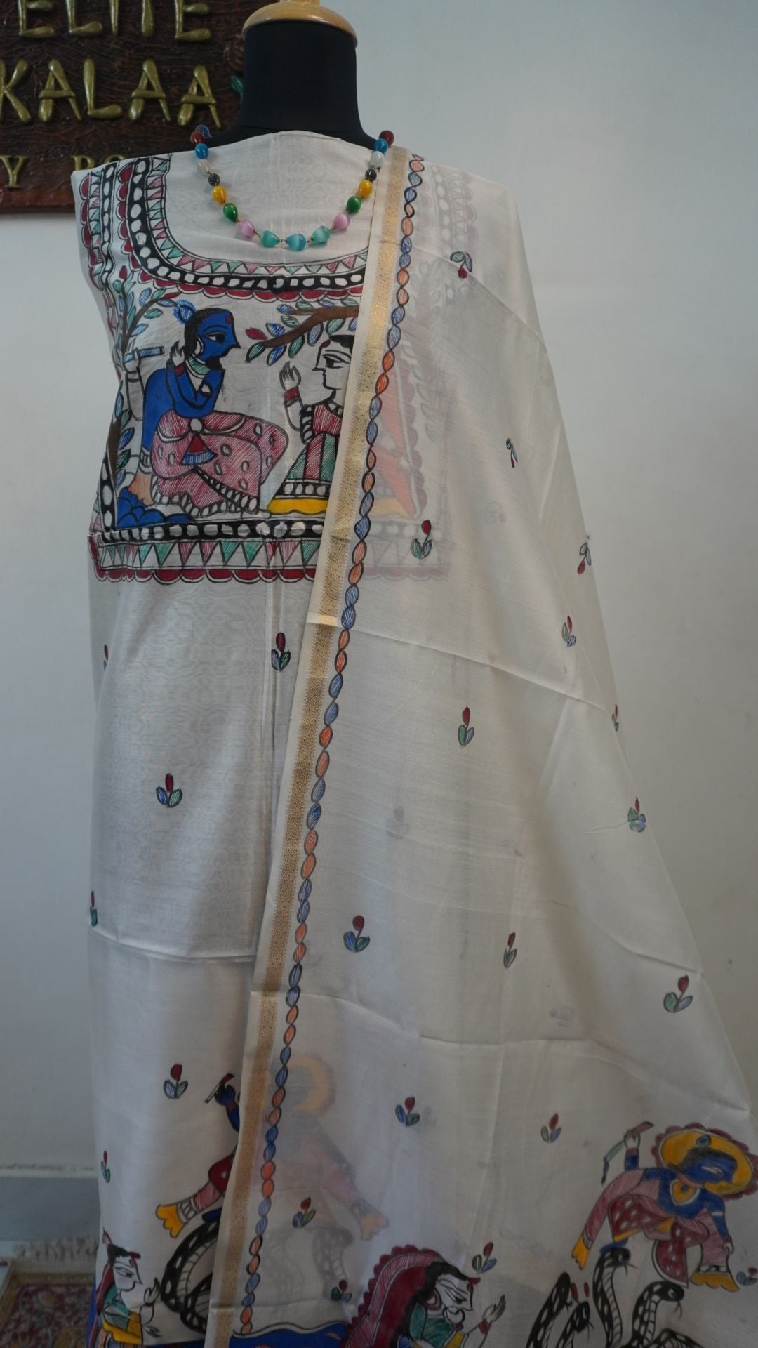 Off white Maheshwari Madhubani 2 piece suit set with figurative pattern, border and fringe detail.