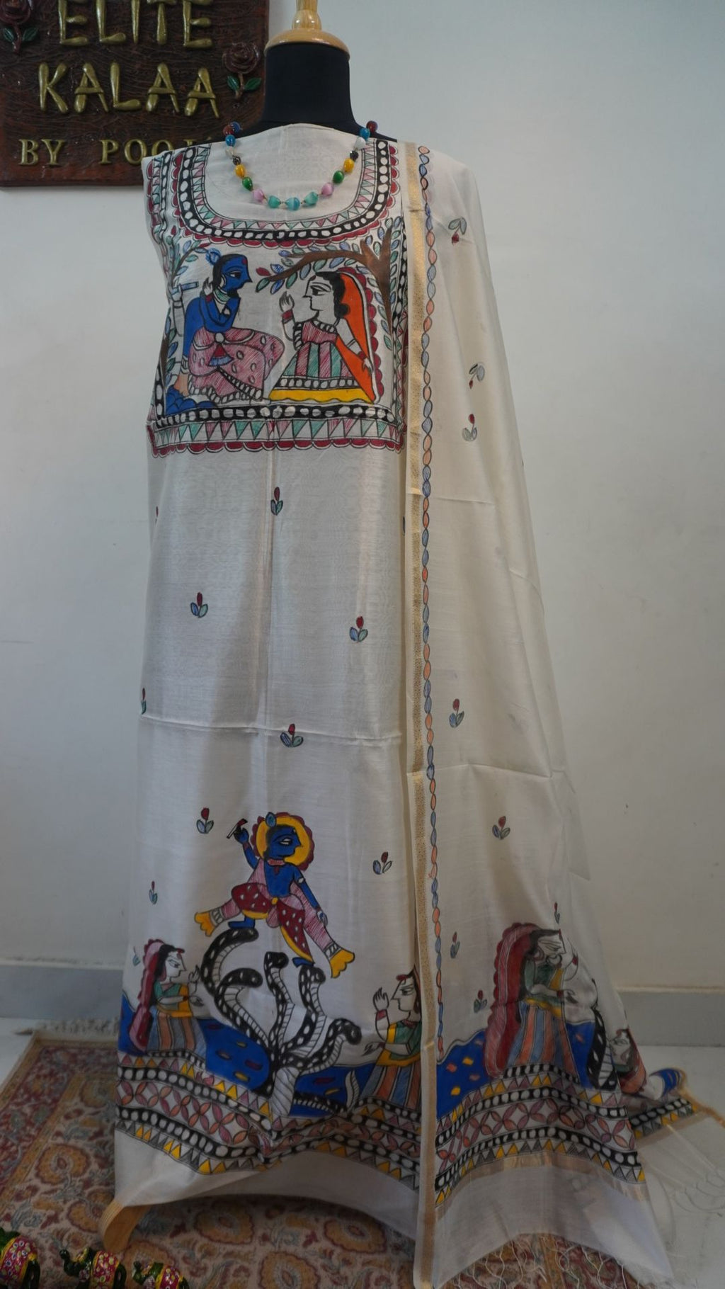 Off white Maheshwari Madhubani 2 piece suit set with figurative pattern, border and fringe detail.