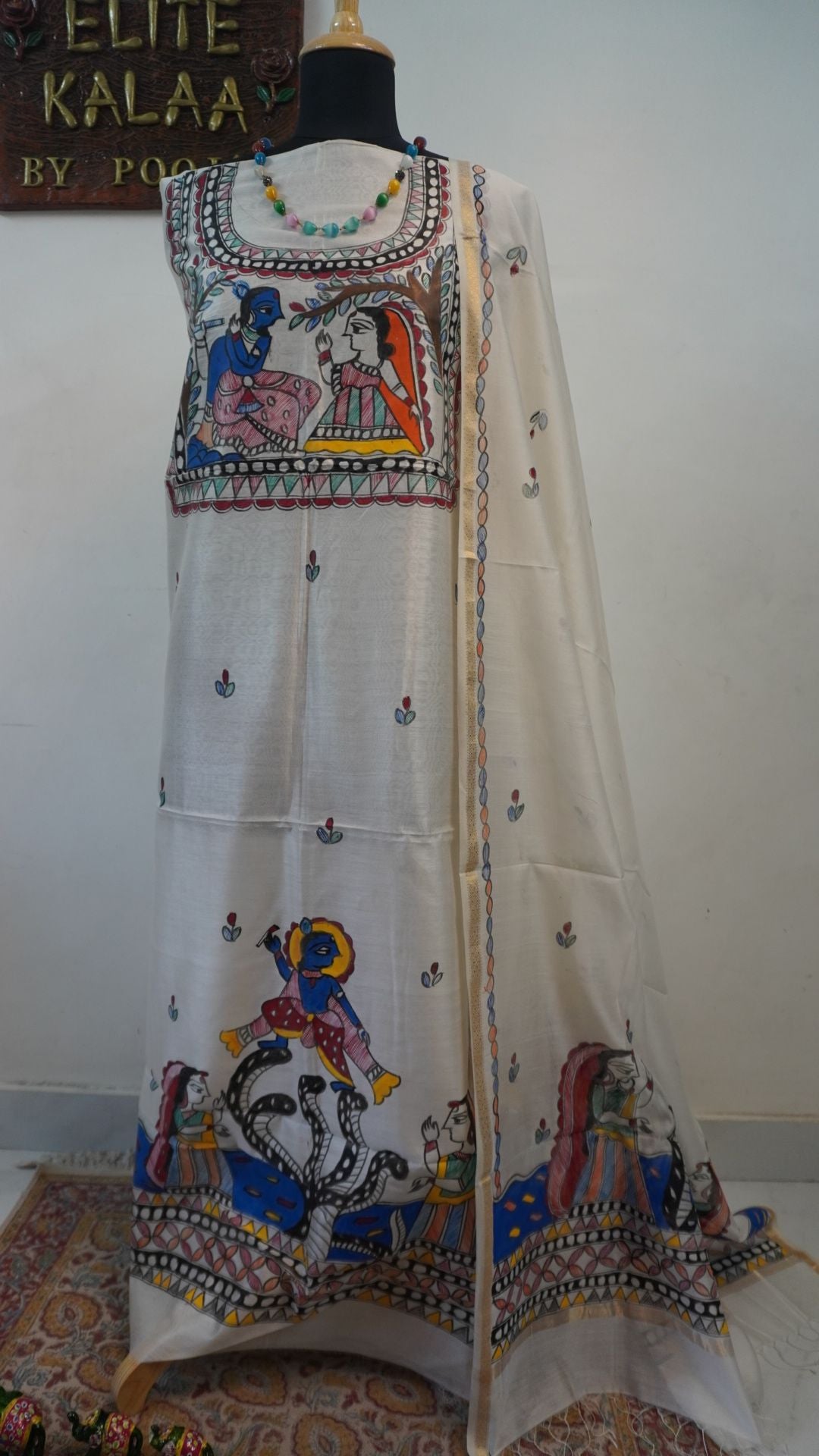 Off white Maheshwari Madhubani 2 piece suit set with figurative pattern, border and fringe detail.