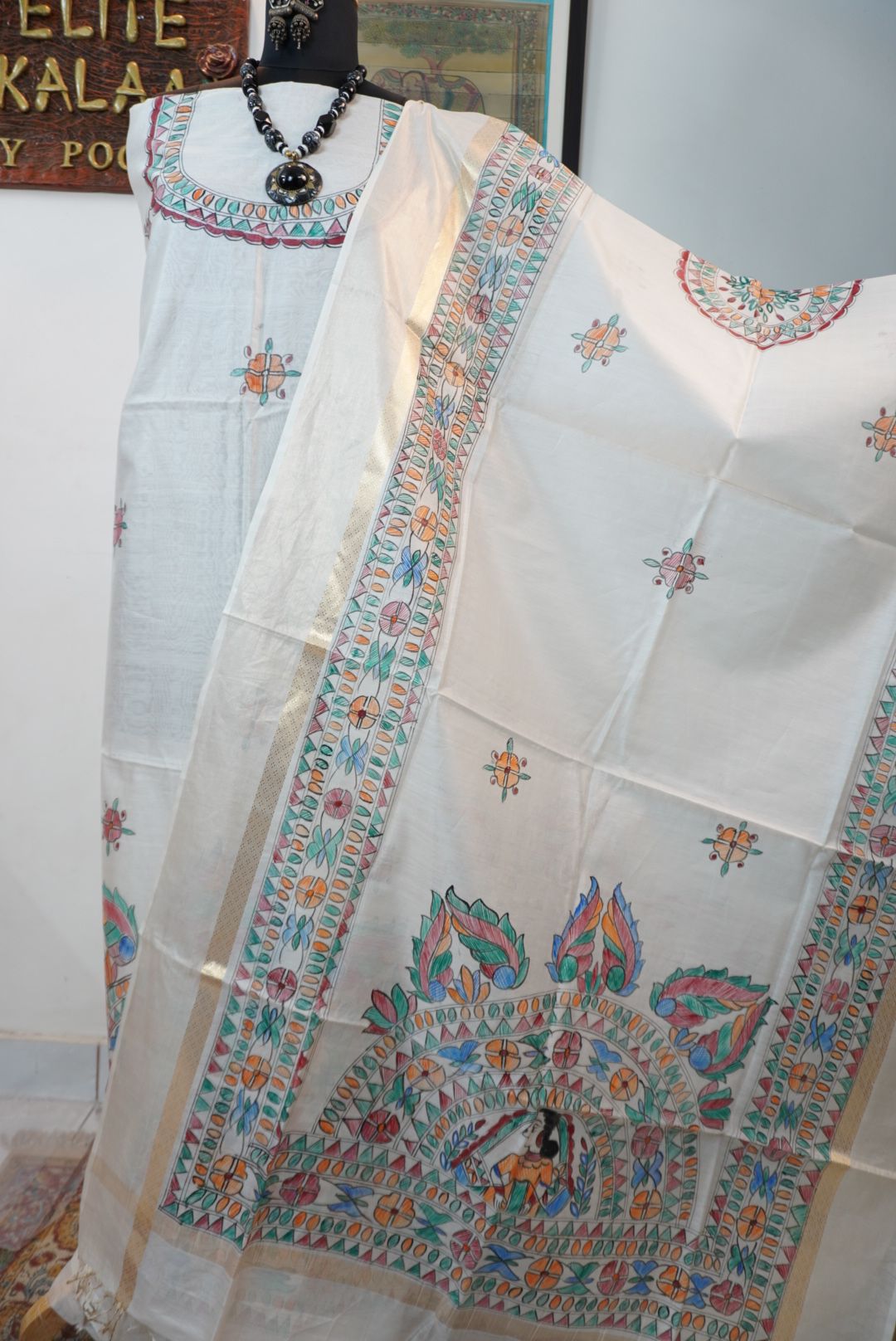 Blue dress material with Madhubani placement pattern and a visible border