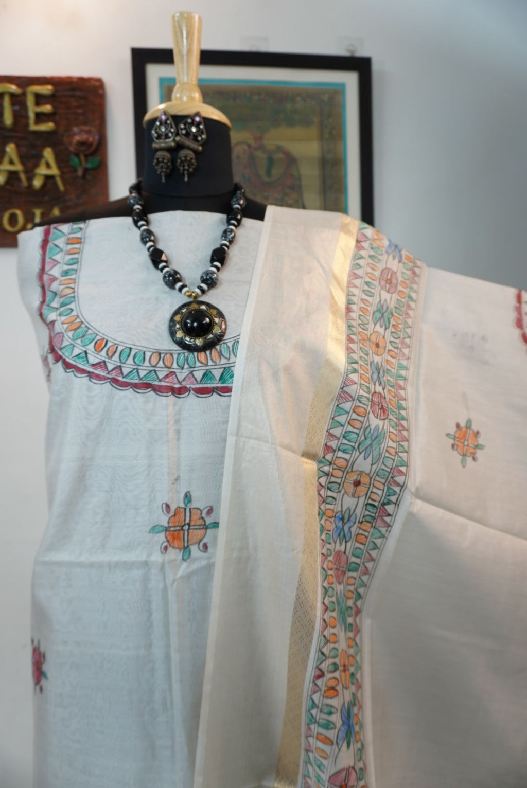 Blue dress material with Madhubani placement pattern and a visible border
