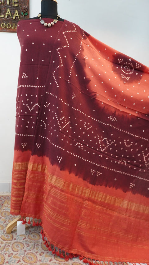 Ajrakh handblock bandhni 2 piece suit in carrot pink and maroon with border, tassels and zari detailing