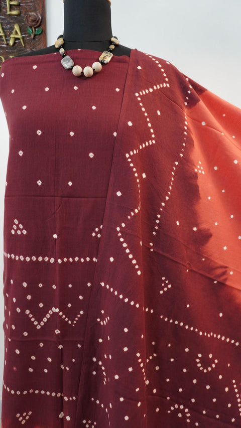 Ajrakh handblock bandhni 2 piece suit in carrot pink and maroon with border, tassels and zari detailing