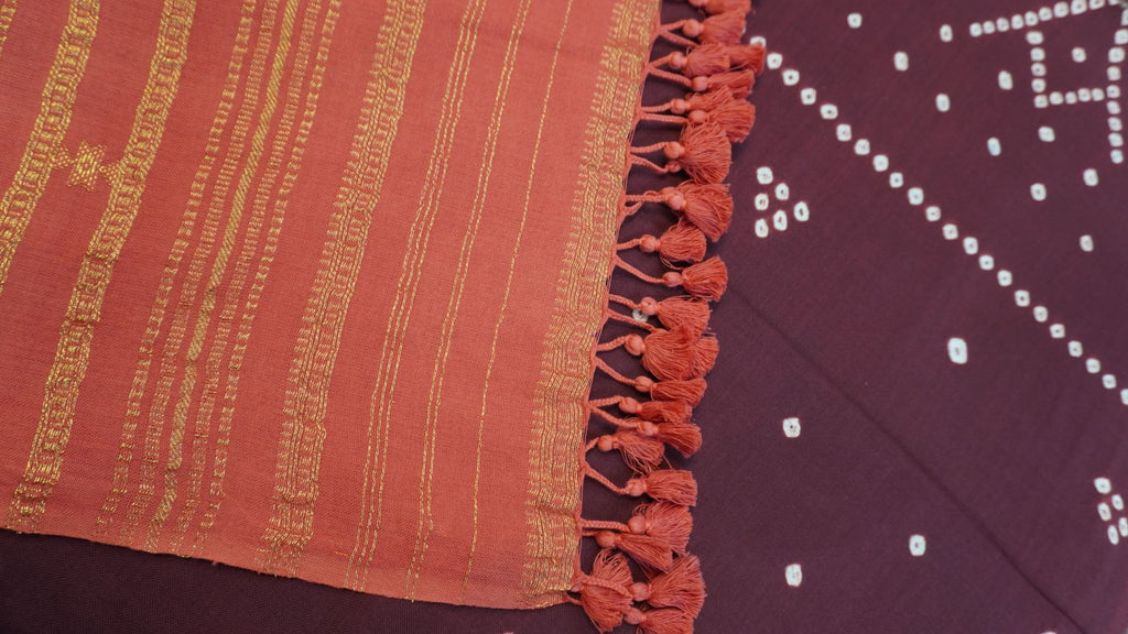 Ajrakh handblock bandhni 2 piece suit in carrot pink and maroon with border, tassels and zari detailing