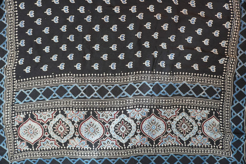 Black Dola silk Ajrakh handblock saree with all-over multicolor design, border and tassels