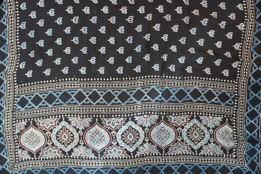 Black Dola silk Ajrakh handblock saree with all-over multicolor design, border and tassels
