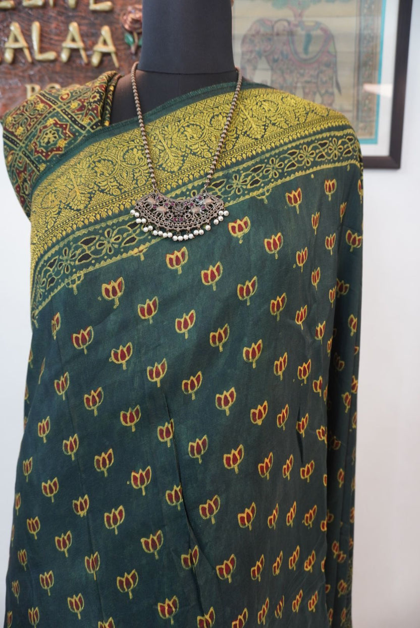 Green Dola silk Ajrakh block print saree with zari detail, border and tassels