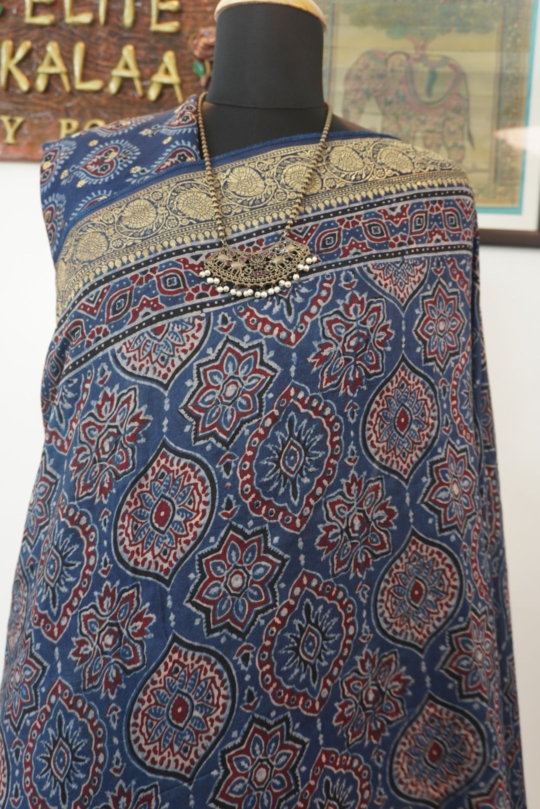 Blue Dola silk Ajrakh saree with multicolor placement pattern, border and zari accents