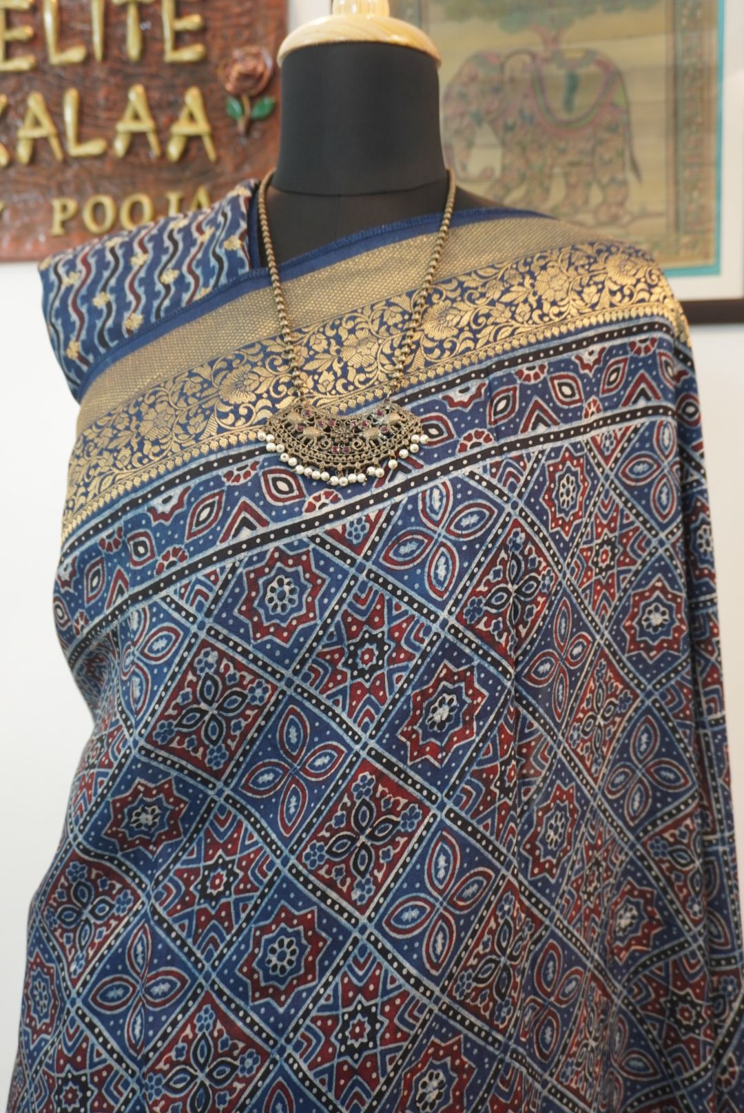 Blue Dola silk Ajrakh saree with multicolor placement pattern, border and zari accents