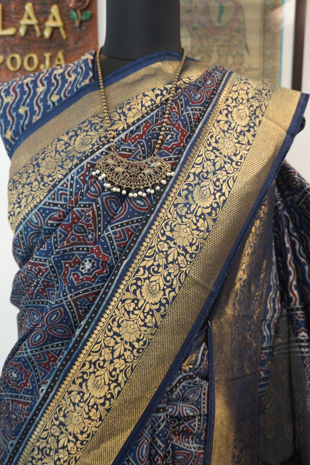 Blue Dola silk Ajrakh saree with multicolor placement pattern, border and zari accents