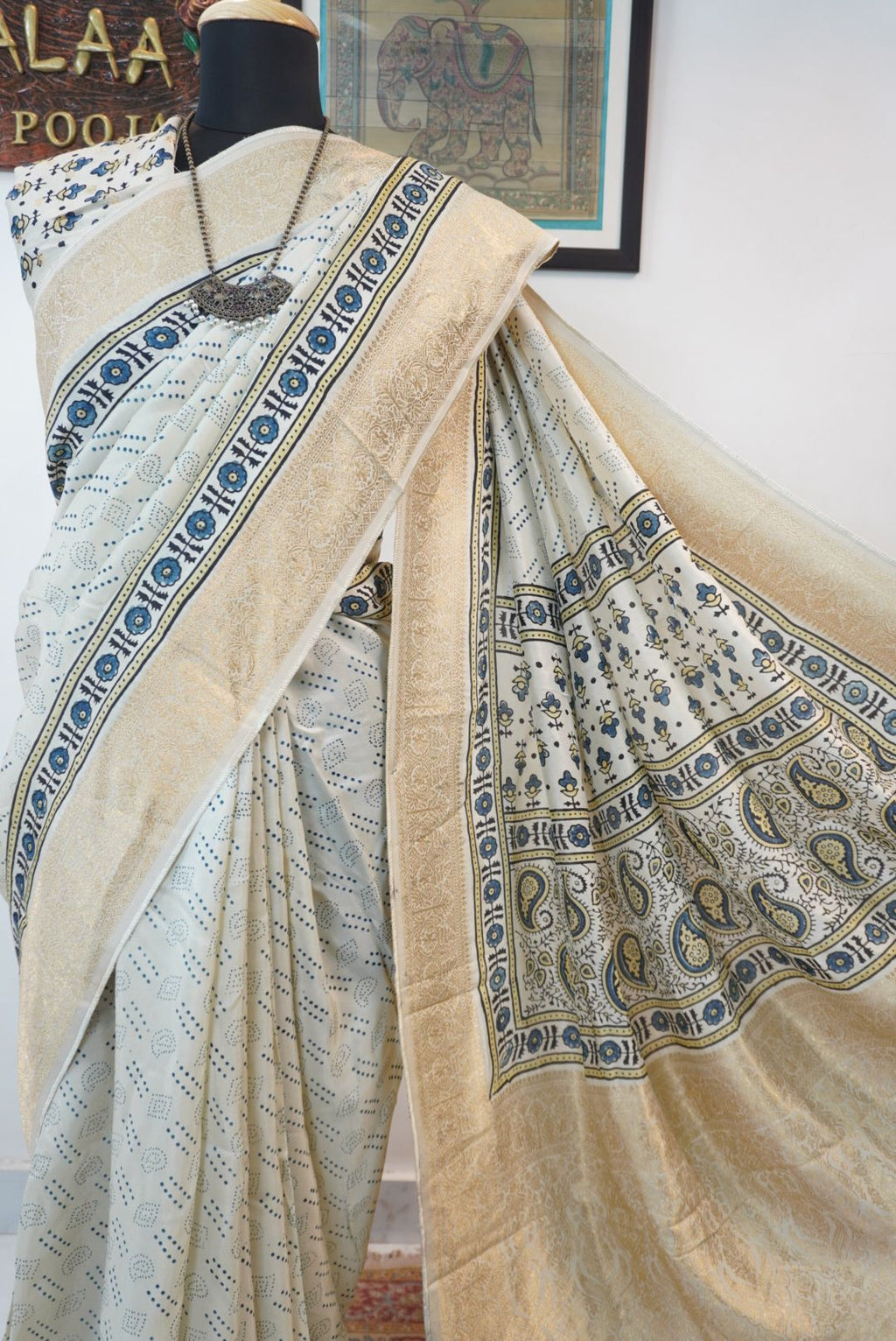 Ivory silk Ajrakh handblock saree with multicolor placement pattern, border detail and blue yellow black accents