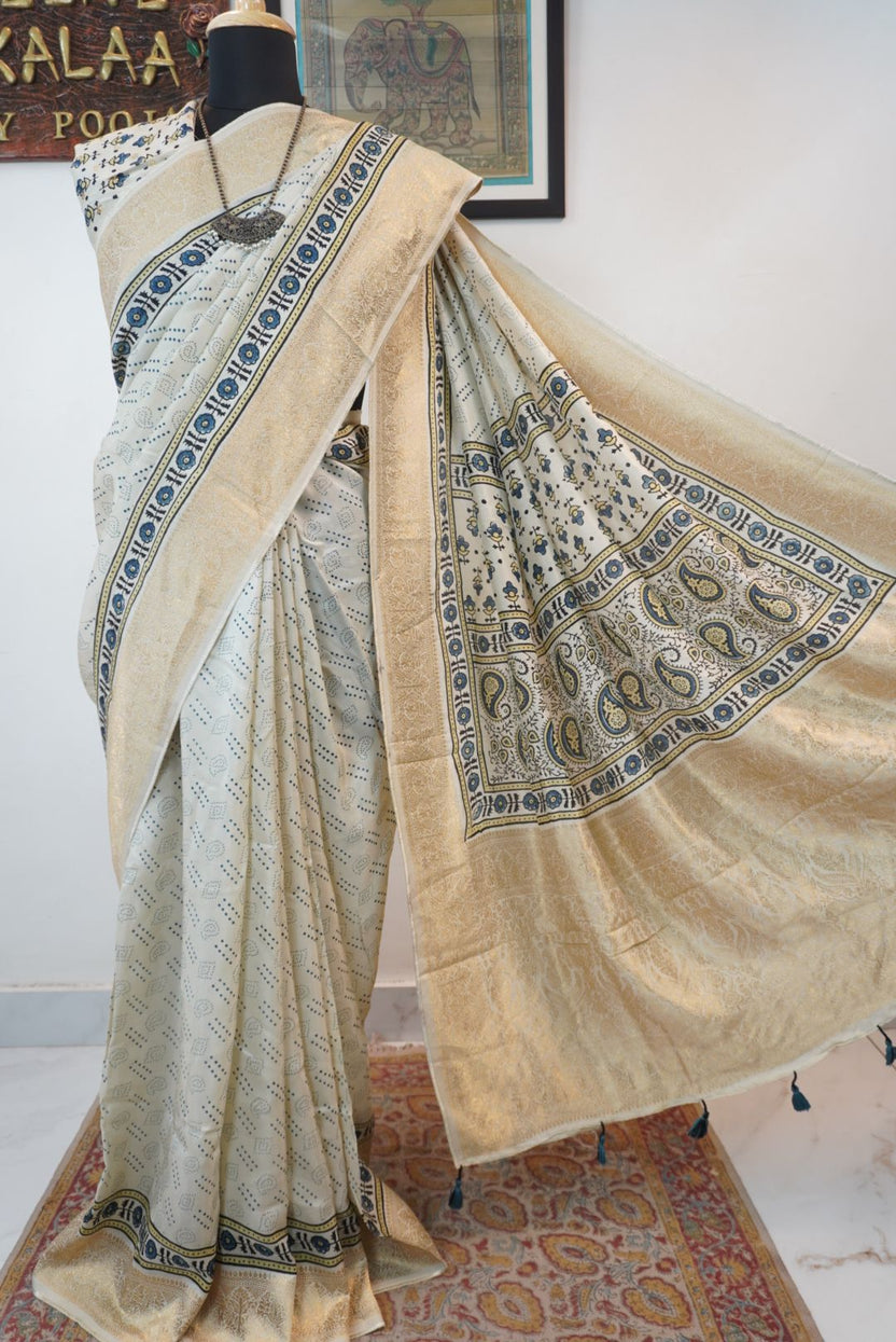 Ivory silk Ajrakh handblock saree with multicolor placement pattern, border detail and blue yellow black accents