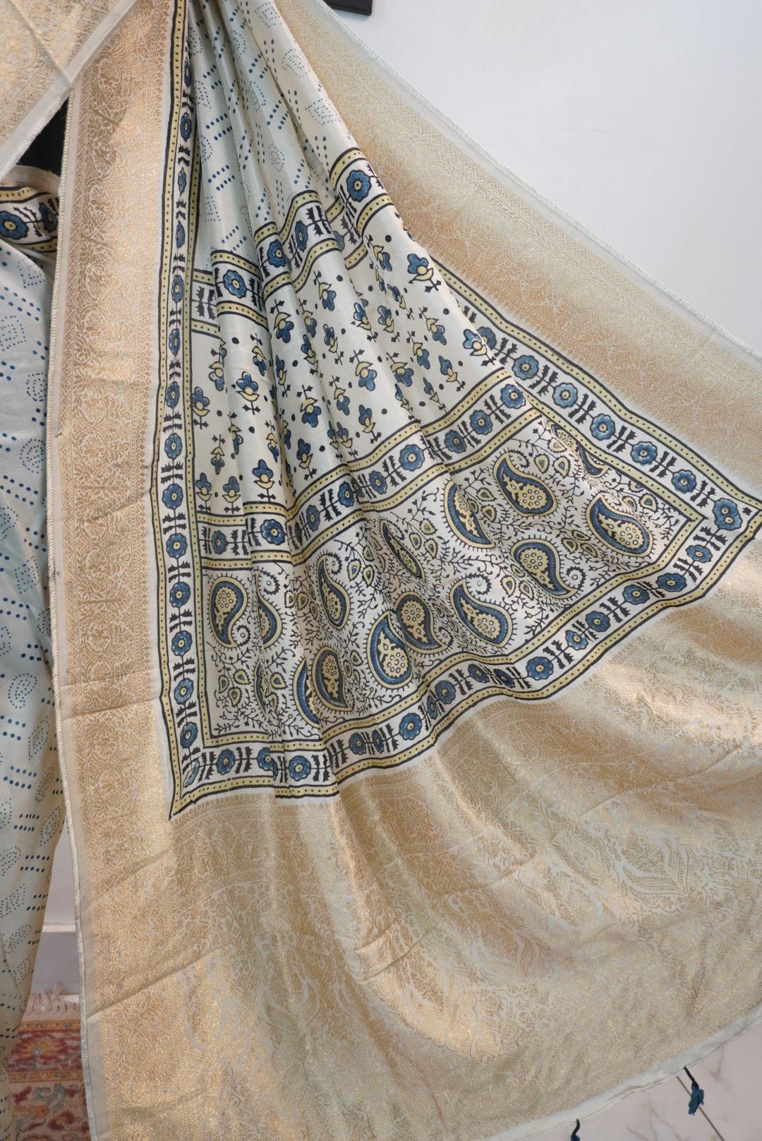 Ivory silk Ajrakh handblock saree with multicolor placement pattern, border detail and blue yellow black accents