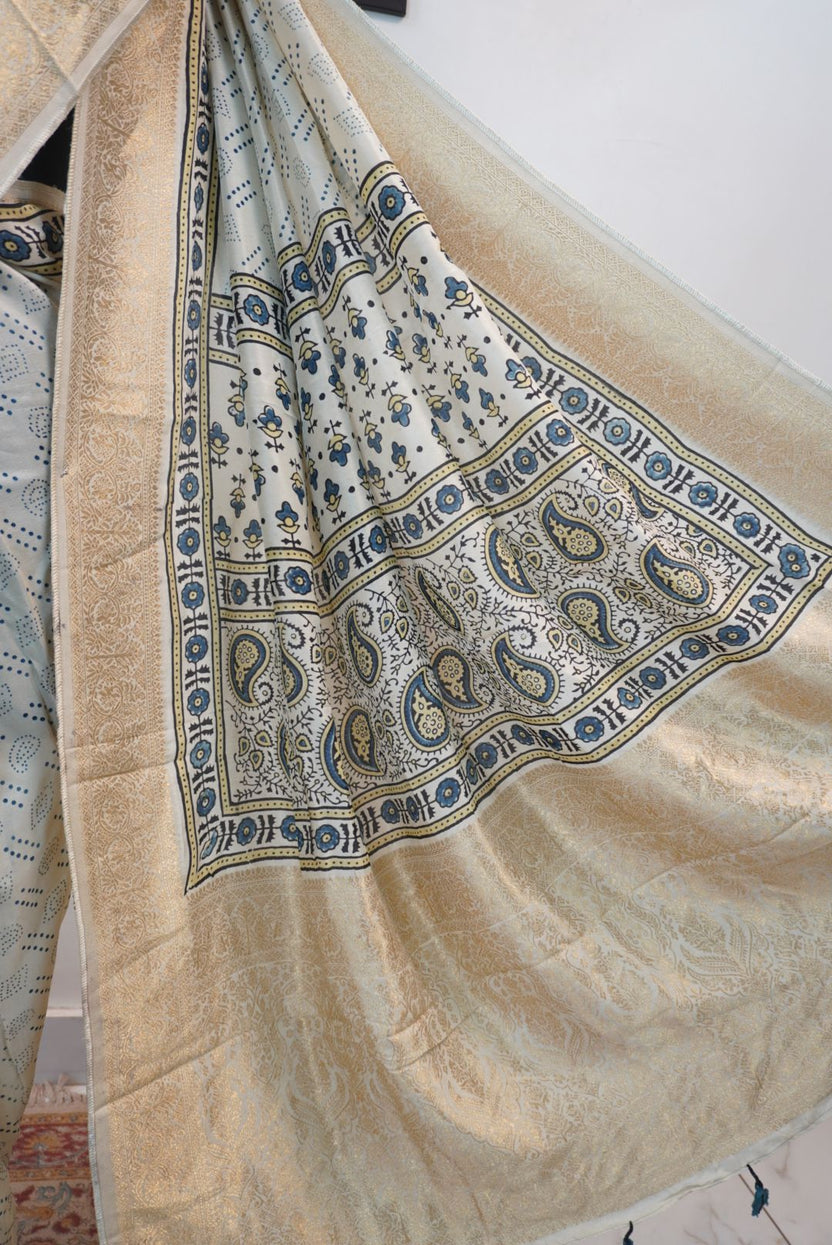 Ivory silk Ajrakh handblock saree with multicolor placement pattern, border detail and blue yellow black accents