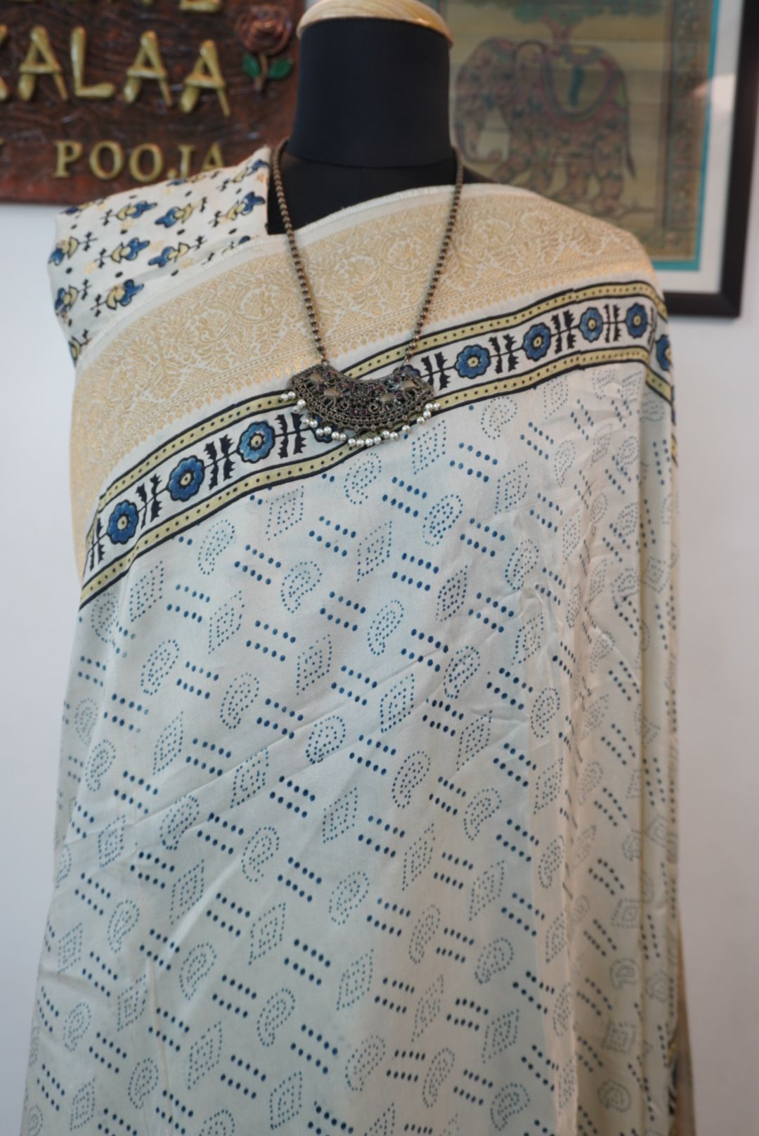 Ivory silk Ajrakh handblock saree with multicolor placement pattern, border detail and blue yellow black accents