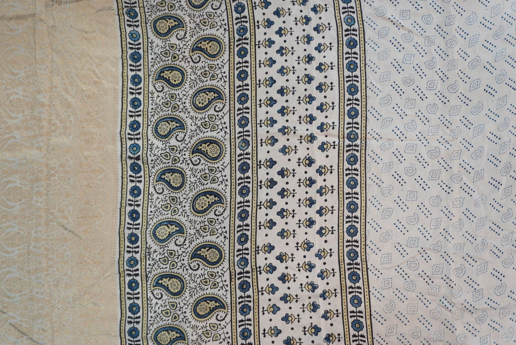 Ivory silk Ajrakh handblock saree with multicolor placement pattern, border detail and blue yellow black accents