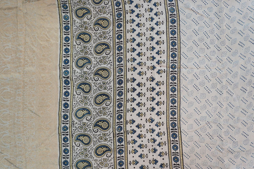 Ivory silk Ajrakh handblock saree with multicolor placement pattern, border detail and blue yellow black accents