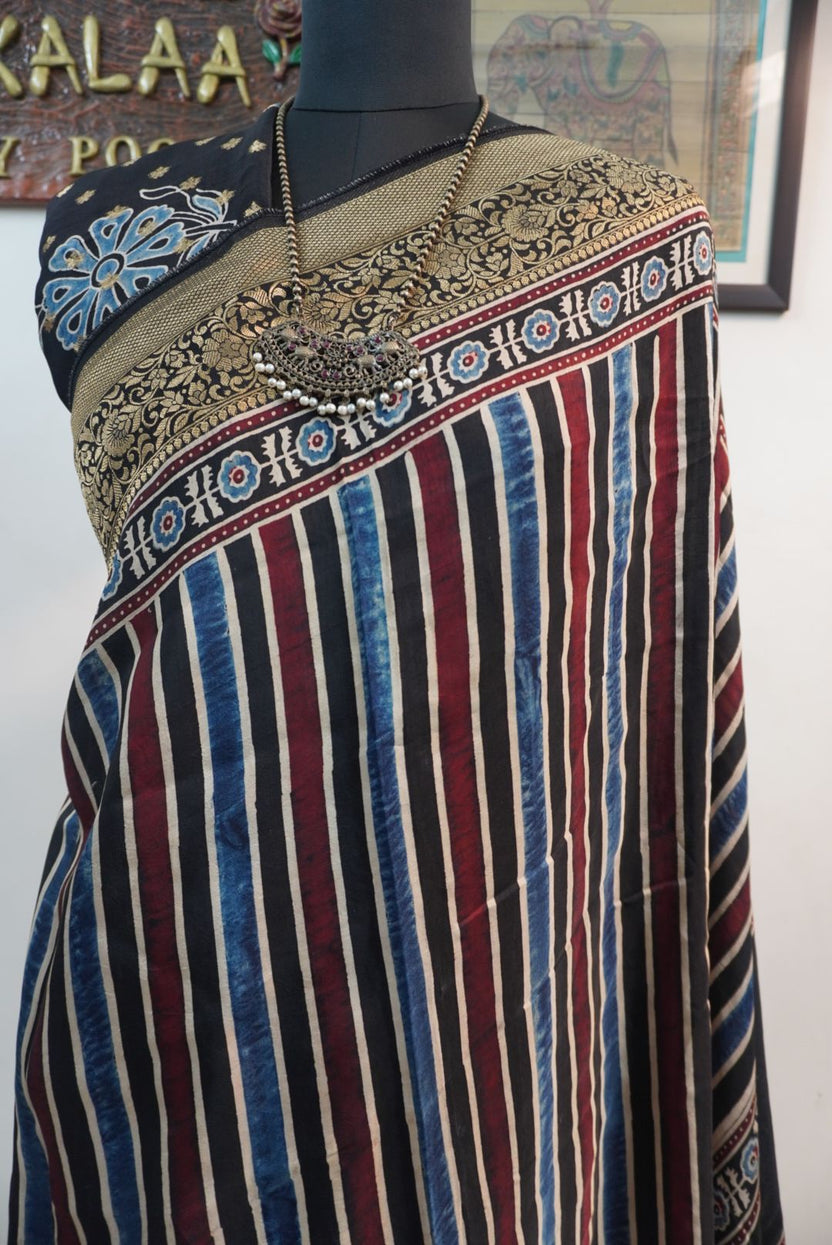 Dola silk Ajrakh handblock saree with multicolour striped design, border and tassels